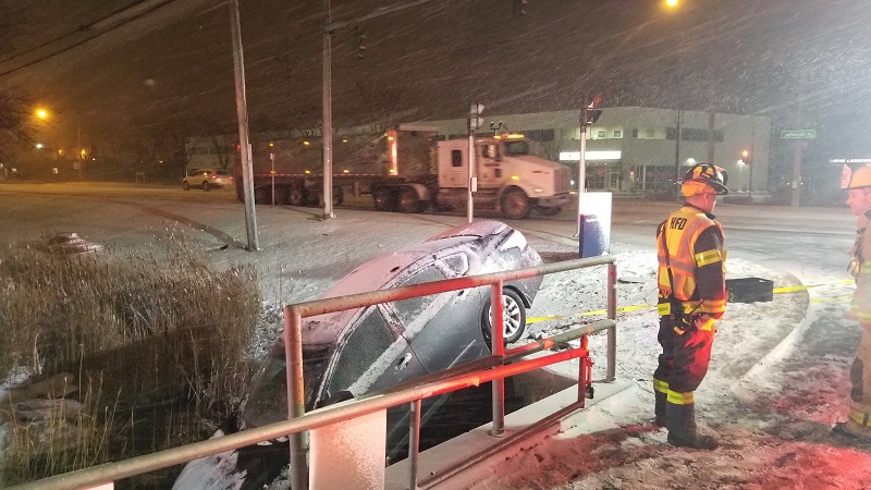 Sedan crashes in ditch due to icy roads