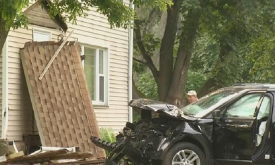SUV crashes into pole, house in Penfield