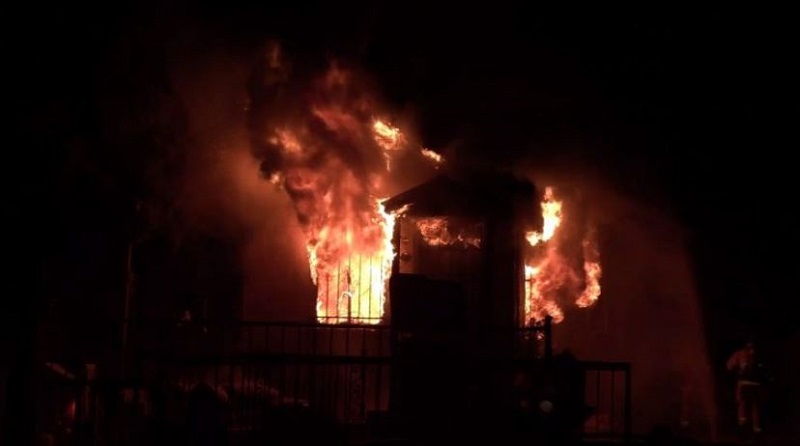 Police looking for man accused of setting home on fire