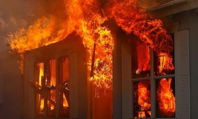 Heavy flames coming from the roof of a Webster home