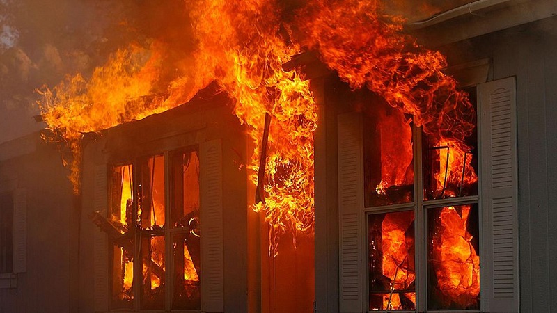 Heavy flames coming from the roof of a Webster home