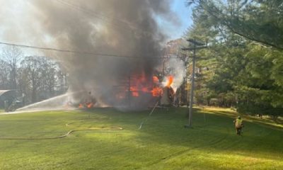 Neighbor pulls woman from her burning home in Lima