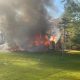 Neighbor pulls woman from her burning home in Lima