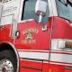 Amid second-alarm fire, a man calls 911, assaults officers