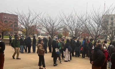 A rally is conducted while students are charged with felonies in a “wanted” poster case