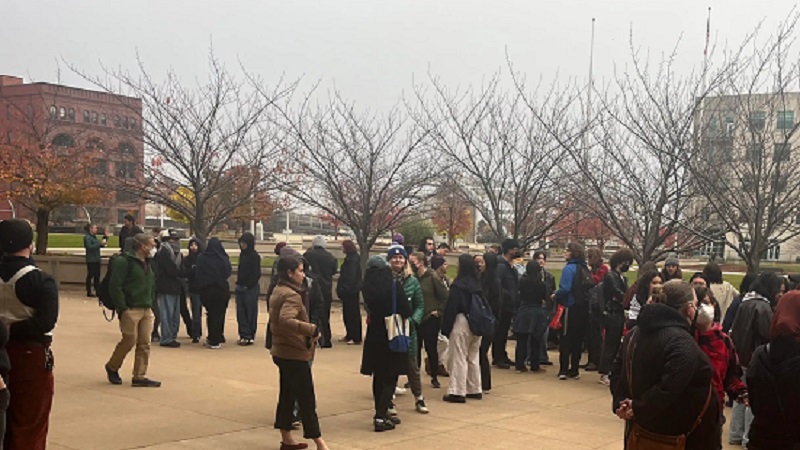 A rally is conducted while students are charged with felonies in a “wanted” poster case