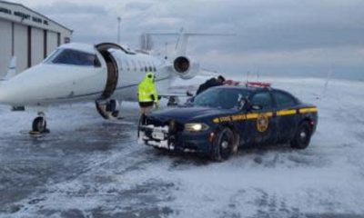 A woman is transported by troopers for a heart transplant amid a snowfall