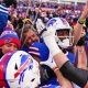 As Buffalo defeats the Broncos in the wild-card game, Bills supporters celebrate joyfully at Bar Bill East